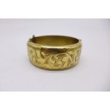 A 9ct gold on silver bangle,