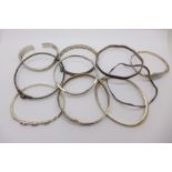 Ten silver bangles