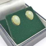A pair of 9ct gold and jade stud earrings