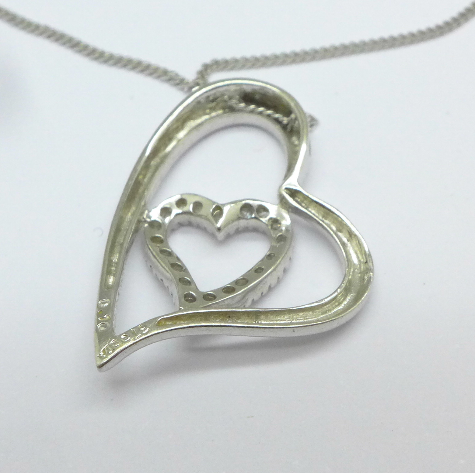 A 9ct white gold and diamond pendant and a 9ct white gold chain, - Image 2 of 2