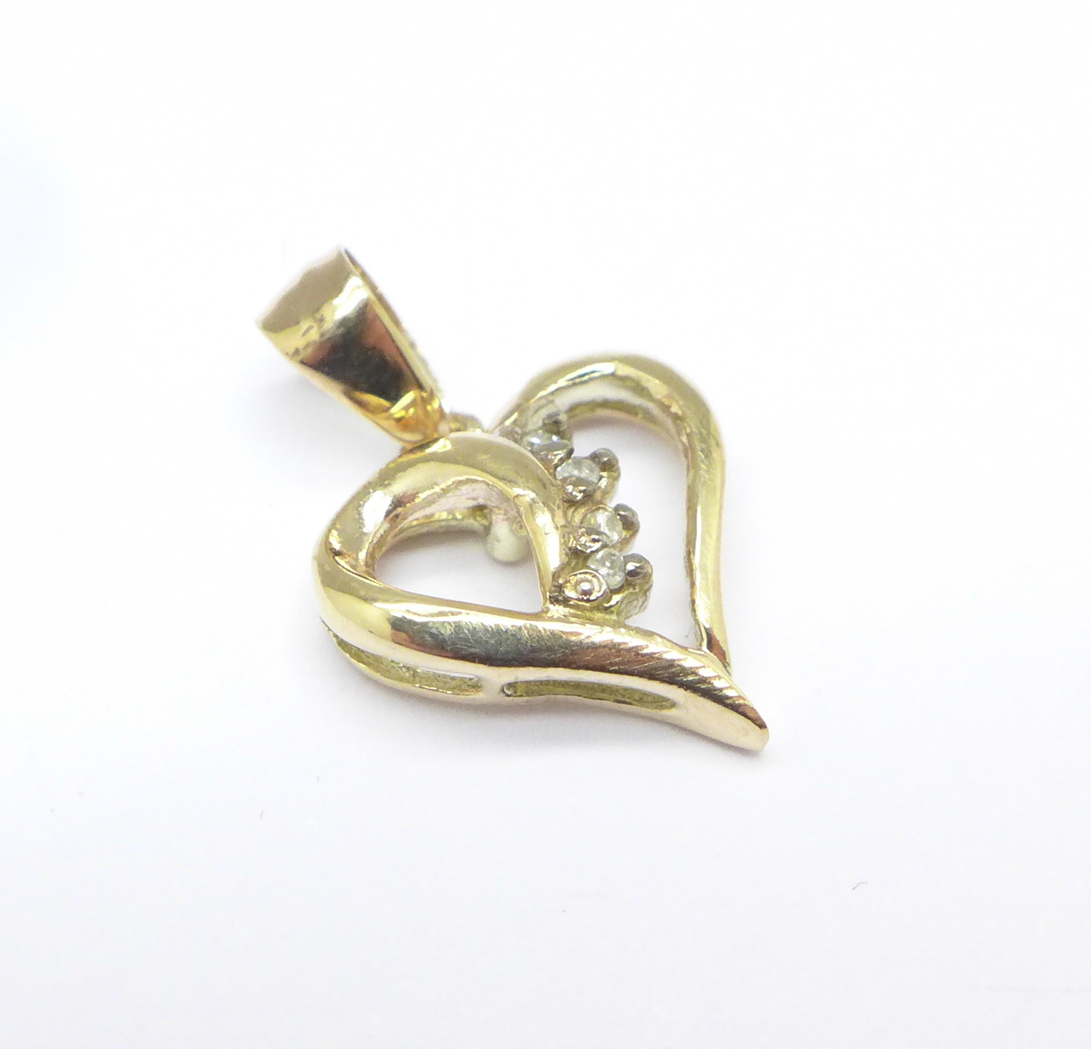 A 9ct gold and diamond pendant