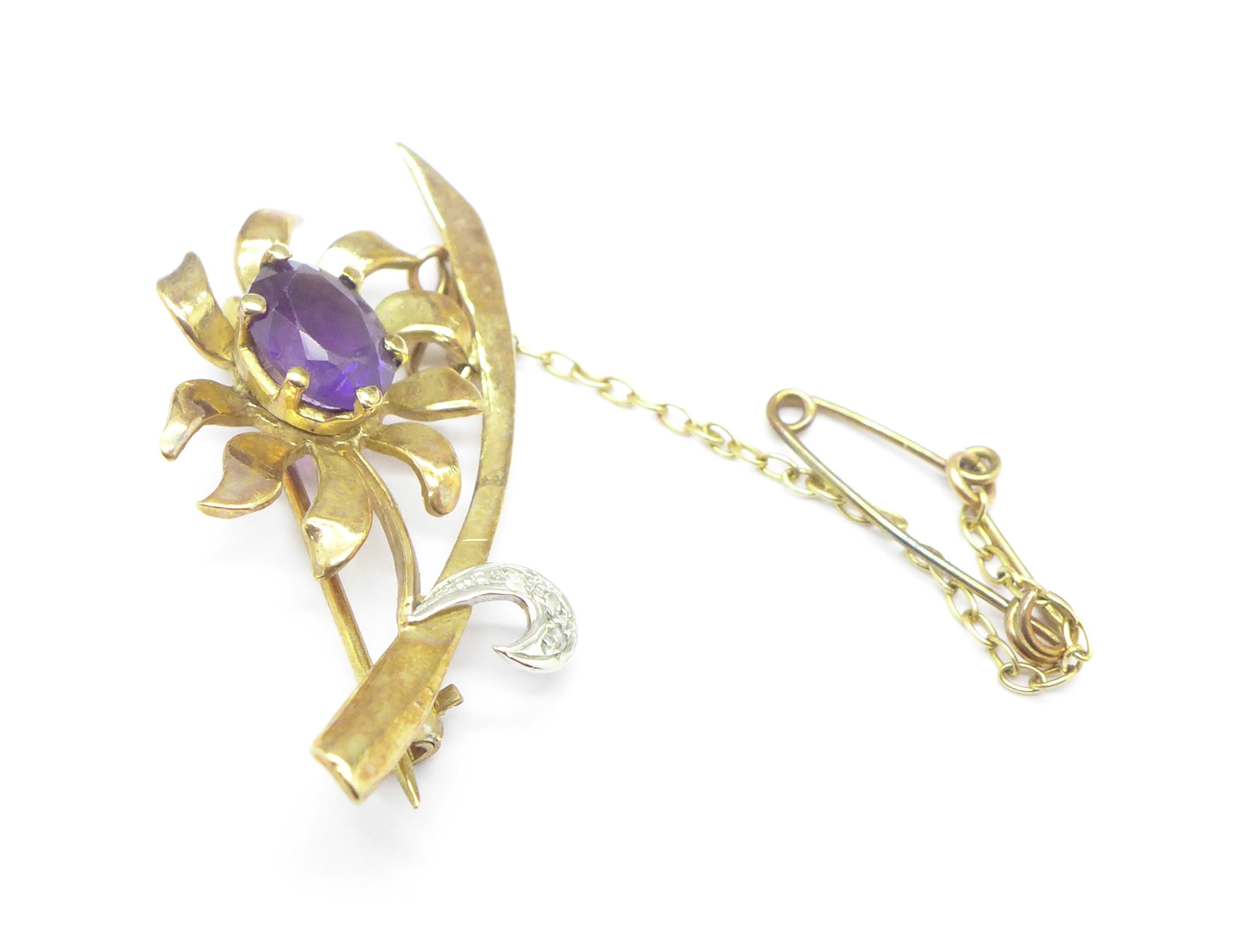 A 9ct gold, amethyst and diamond brooch, 3.