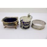 A Victorian silver mustard, a silver salt and a silver napkin ring, liners a/f, 65.