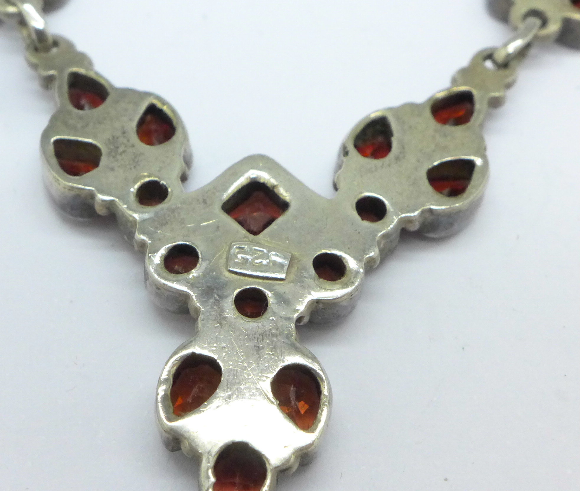 A silver and garnet necklet marked 925 - Image 4 of 4