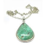 A silver and turquoise pendant and chain