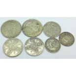 Four pre 1920 silver coins, 33g, and three pre 1946 coins,