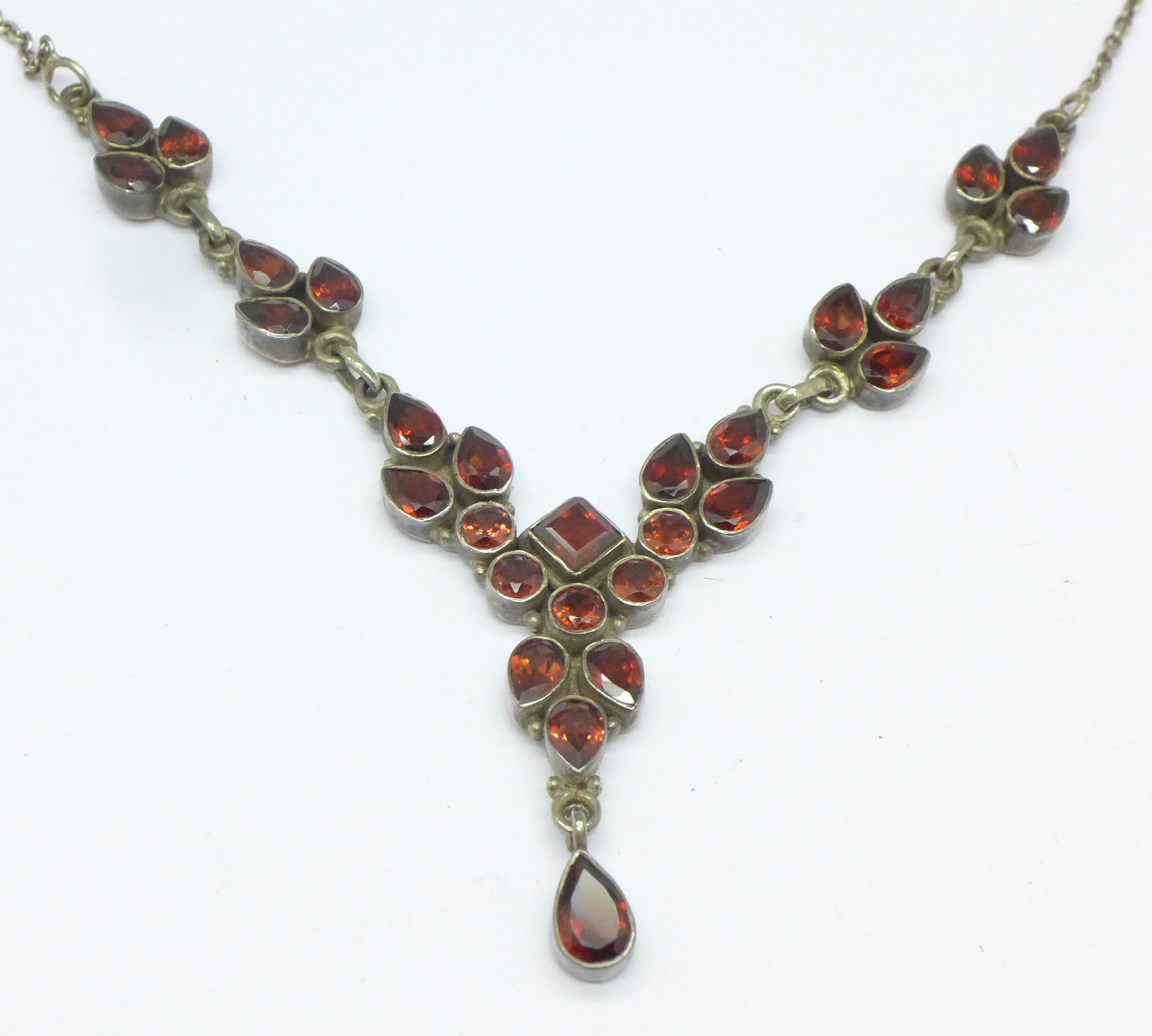 A silver and garnet necklet marked 925 - Image 2 of 4