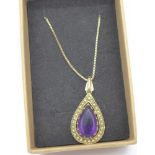A 9ct gold, amethyst and pearl pendant and chain, 5.