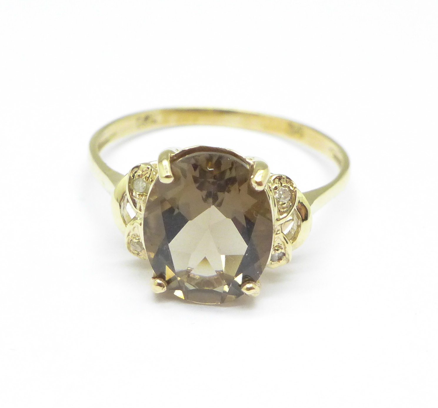 A 9ct gold, smoky quartz and diamond ring, 1.