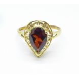 A 9ct gold and garnet ring, 1.