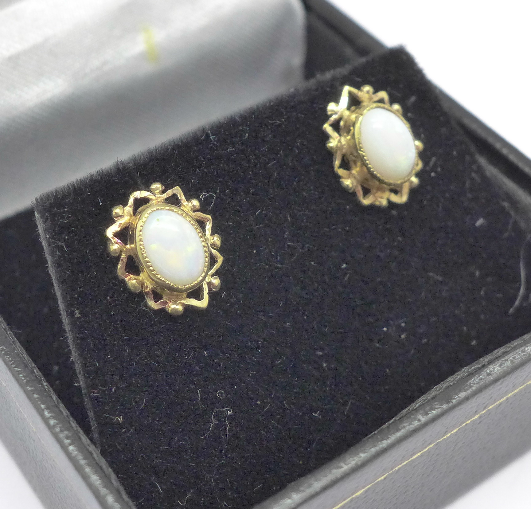 A pair of 9ct gold and opal stud earrings