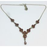 A silver and garnet necklet marked 925