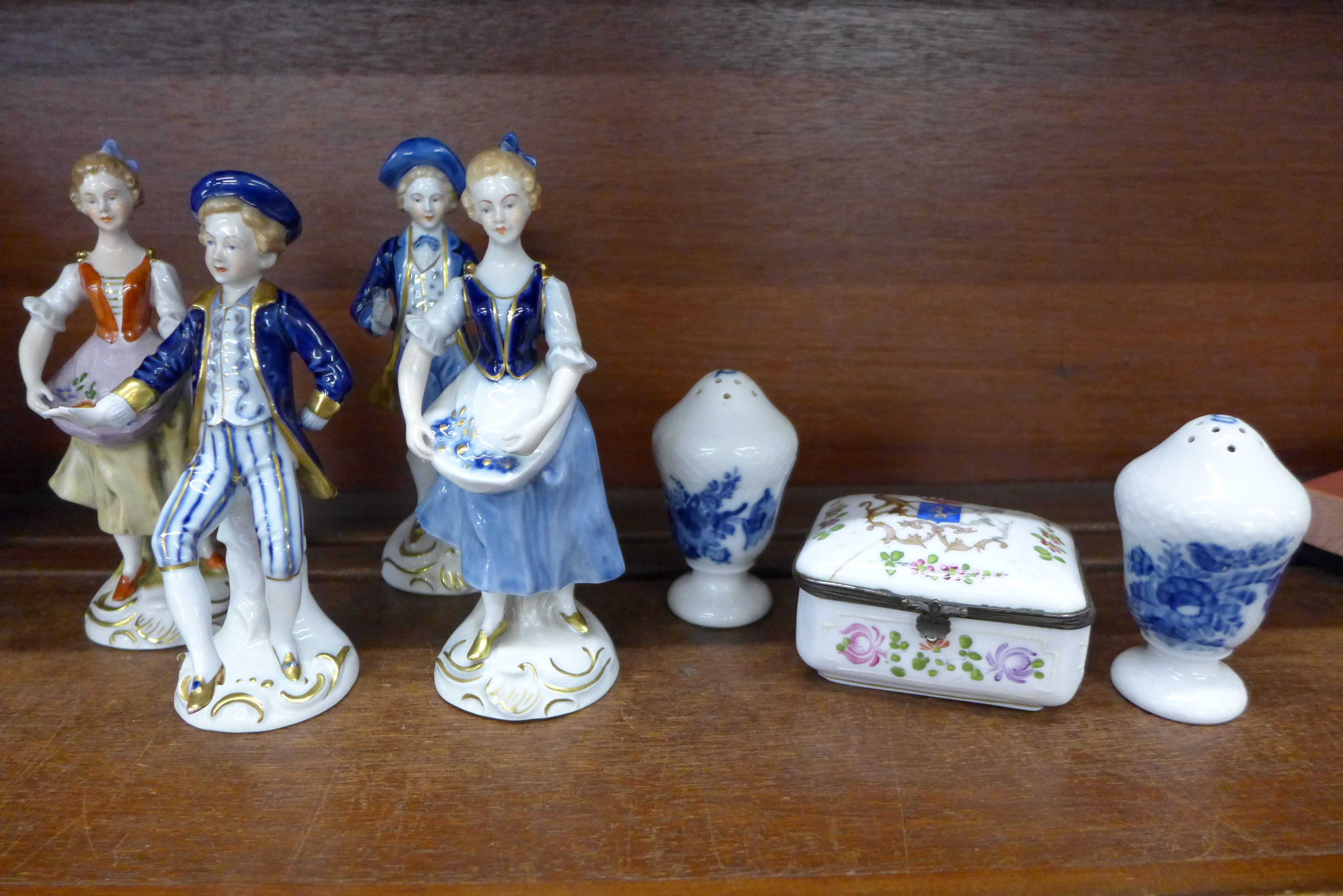 Four Bavarian Echt Kobalt figures and a pair of Royal Copenhagen peppers,