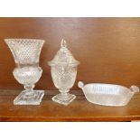 A thistle shaped crystal vase, a lidded glass vase, chip to the rim,