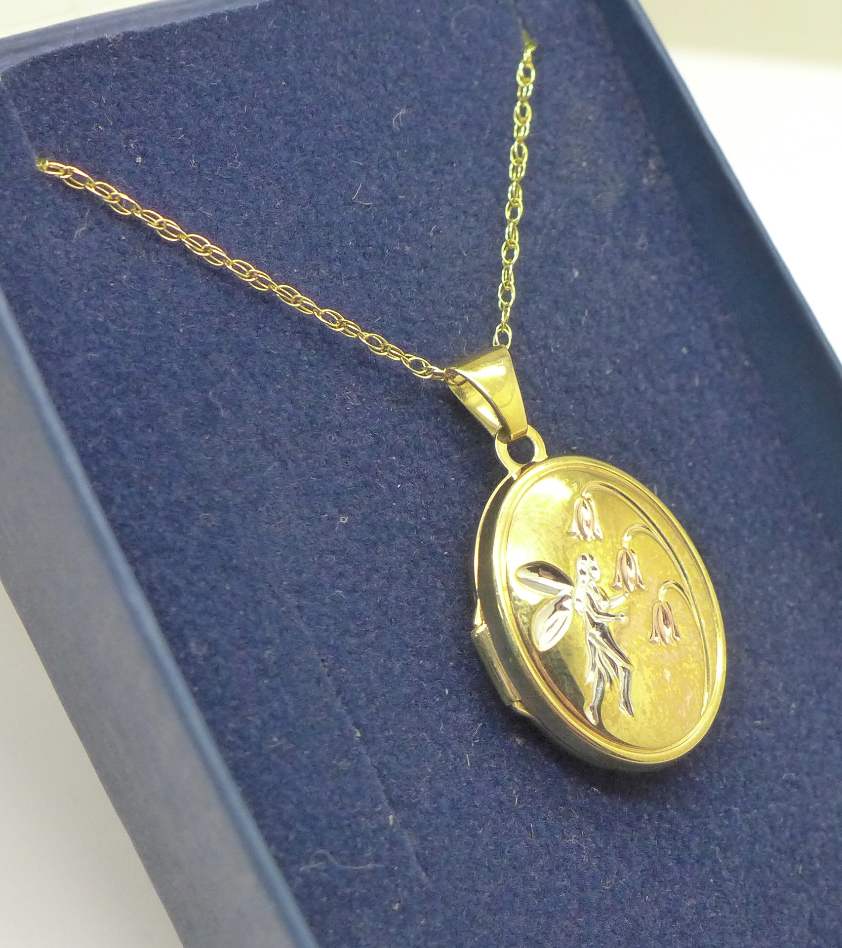 A 9ct gold Fairy locket and chain, 2.