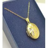 A 9ct gold Fairy locket and chain, 2.