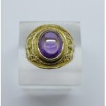 A 9ct gold, cabochon amethyst 1961 graduation ring, 9.