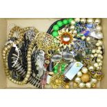 A collection of 1960's and 1970's costume necklaces, brooches, etc.