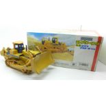 A Shinsei Komatsu D475A bulldozer with metal tracks,