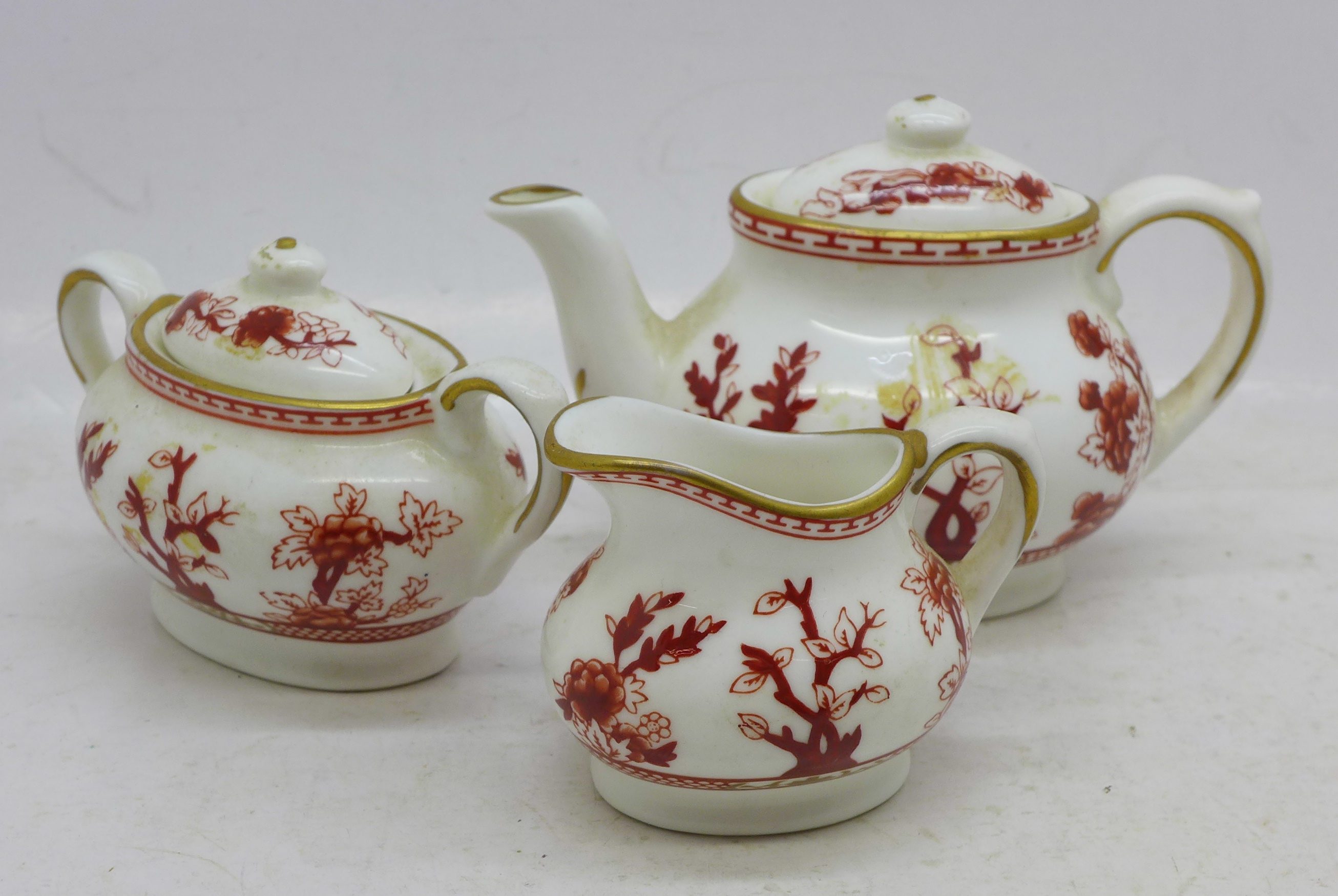 A miniature Coalport china India Tree three piece tea service