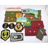 Assorted German and Russian cloth badges and epaulettes