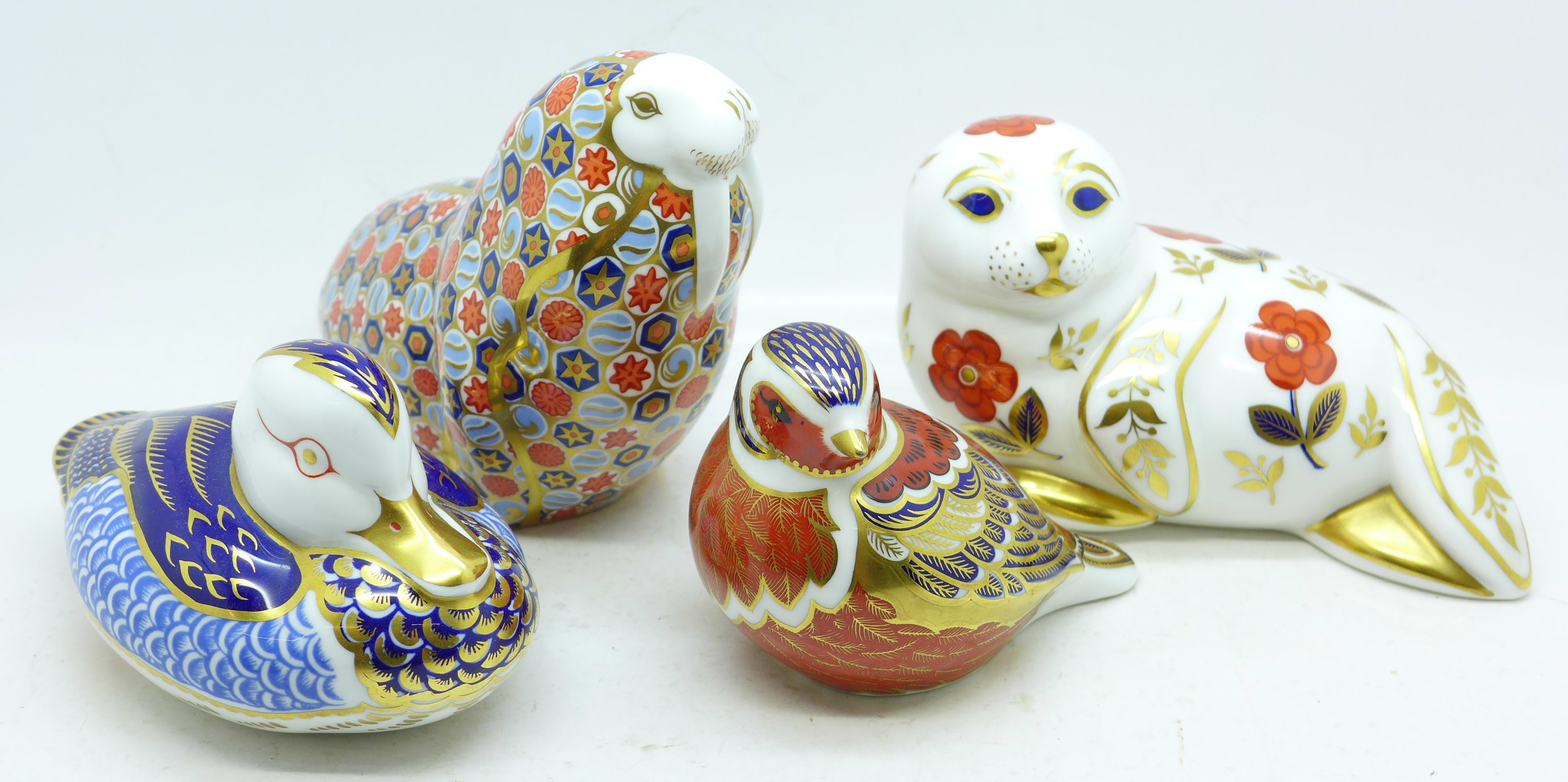 Four Royal Crown Derby paperweights including walrus