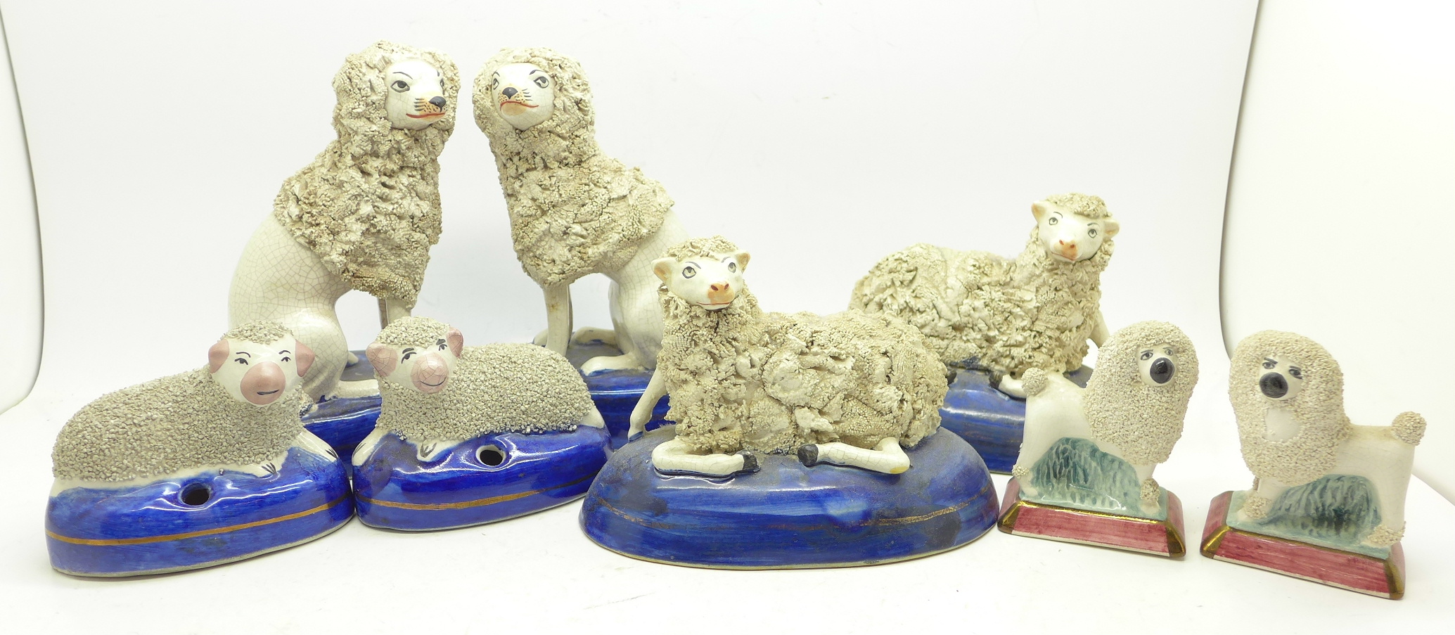 Two pairs of Staffordshire dogs and two pairs of Staffordshire sheep