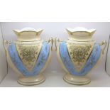 A pair of continental two handled vases