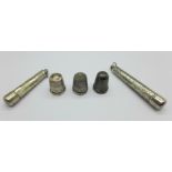 Two silver cheroot cases, a cheroot holder and three silver thimbles,