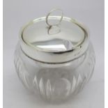 A silver lidded and mounted glass preserve jar