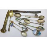 A collection of spoons including silver,