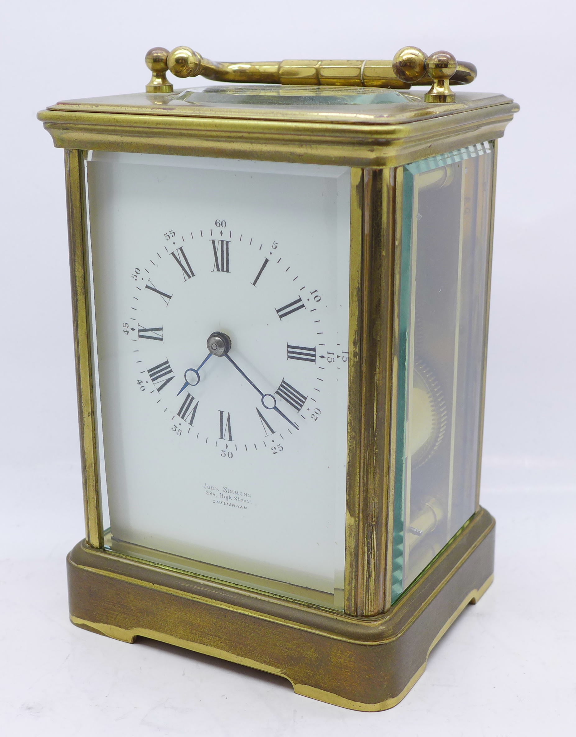 A John Simmons of Cheltenham brass and four glass sided carriage clock, 14.