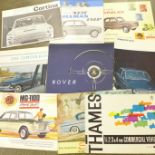 A collection of car brochures including 1950's Rover and Mini Traveller,