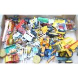 A collection of agricultural figures, die-cast and plastic vehicles, etc.