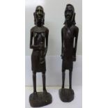 A pair of carved wood African figures,