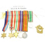 A set of six miniature medals and badge