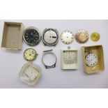 A collection of Omega watch cases, dials, movements,