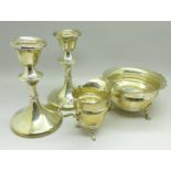 A pair of silver candlesticks, one a/f, and a silver cream and sugar, (172g),