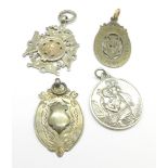 Four silver fobs, one gold mounted and one with gold hoop,