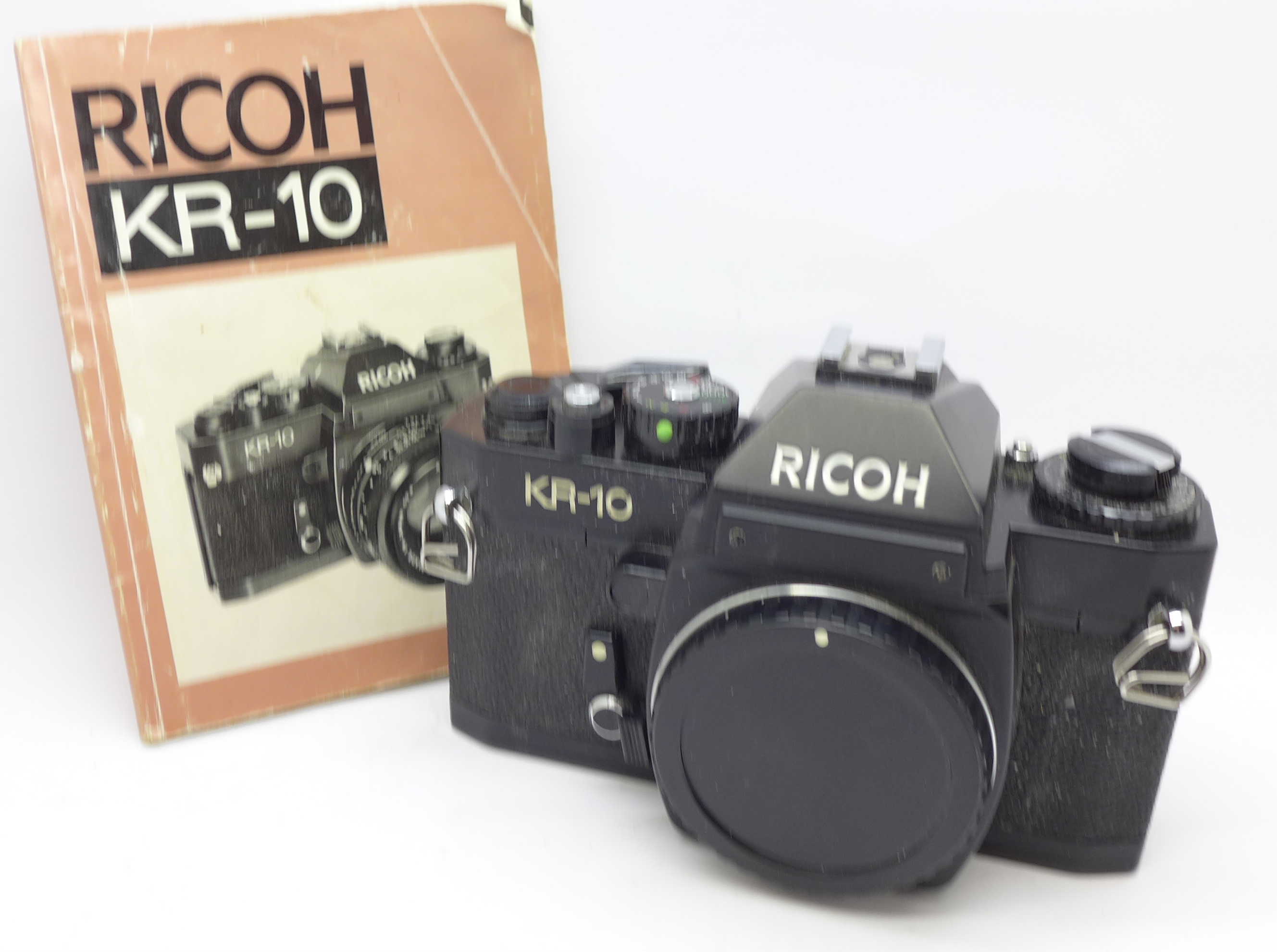 A Ricoh KR-10 camera body and manual