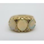 A 9ct gold, opal and diamond seven stone carved claw ring, 2.