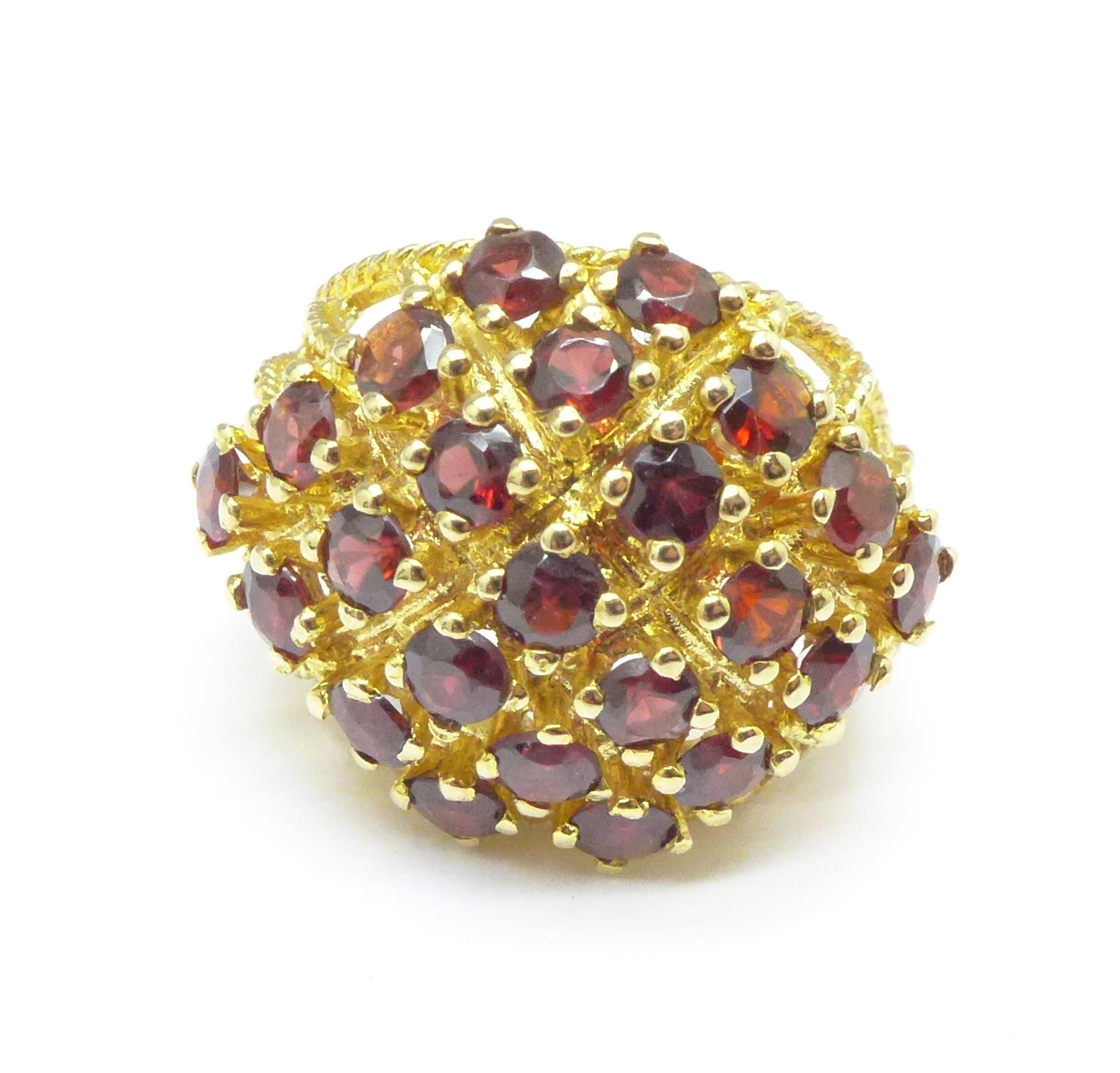 A large 9ct gold garnet set cocktail ring, 7.