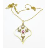 A 9ct gold, seed pearl and red stone pendant and chain, lacking drop, 3.
