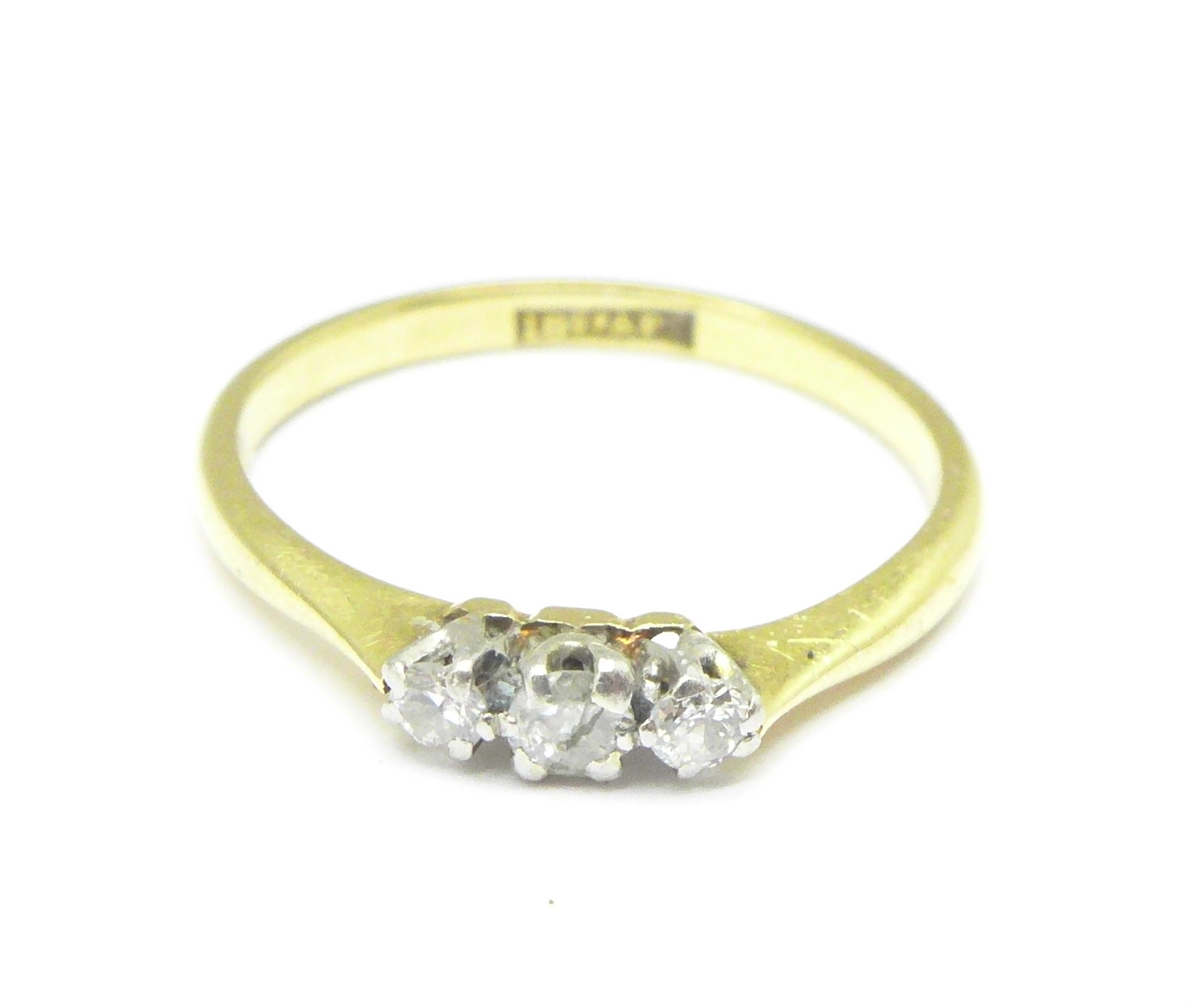 An 18ct gold diamond trilogy ring, 2g,