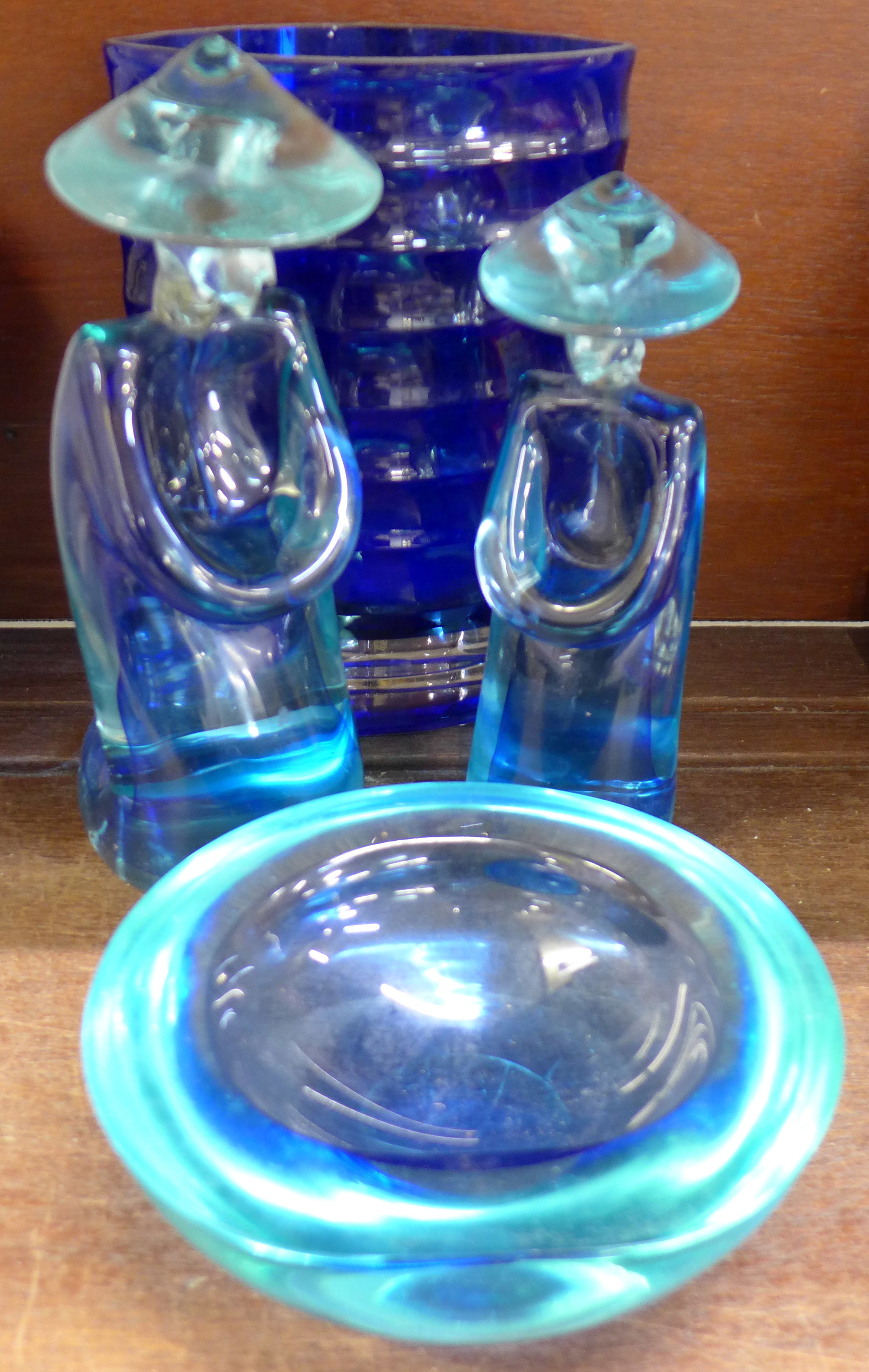 A Venetian glass bowl and two oriental figures,