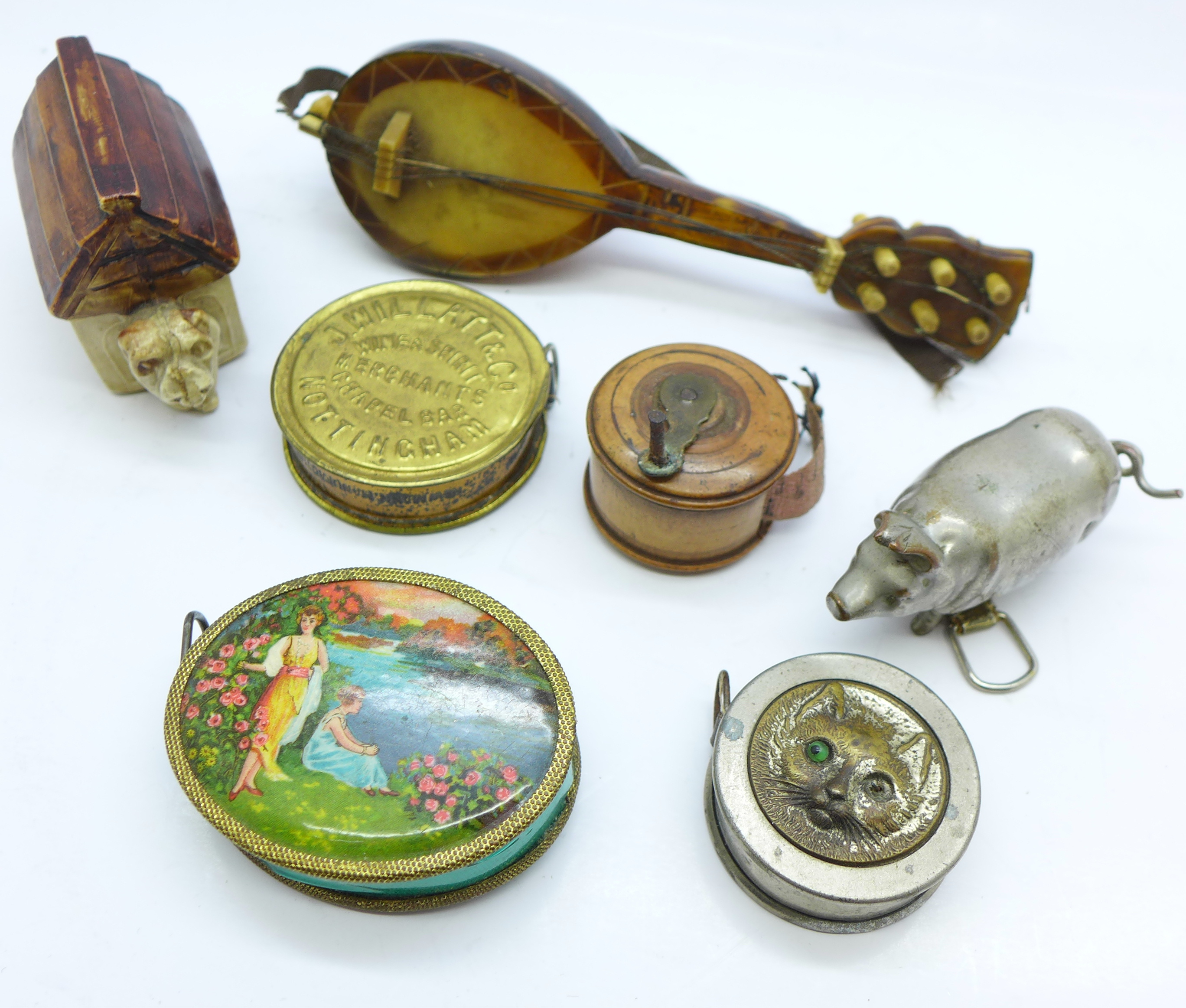 A collection of novelty tape measures,