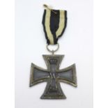 An 1813-1914 German Cross Medal with ribbon