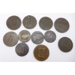 Eleven assorted old bronze tokens