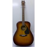 A Yamaha F310 TBS classical guitar and soft case