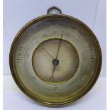 A wall mounted aneroid barometer